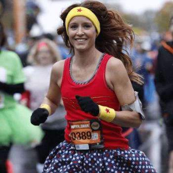 Woman running in Wonder Woman costume.